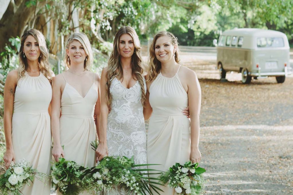 Bride and bridesmaids with vintage Kombi